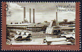 Siam Cement factory in the past, with a fleet of wooden rice barges laying at anchor nearby