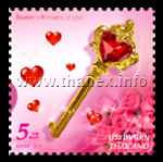 a key to unlock the heart, with a heart-shaped red gem and some pink roses in the background